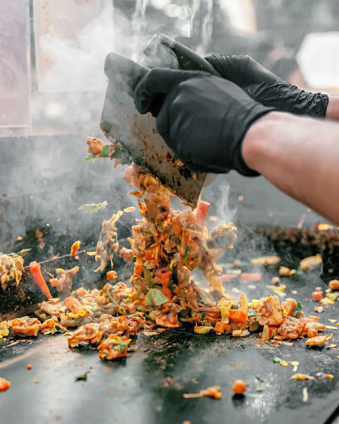 Kottu being prepared on the griddle